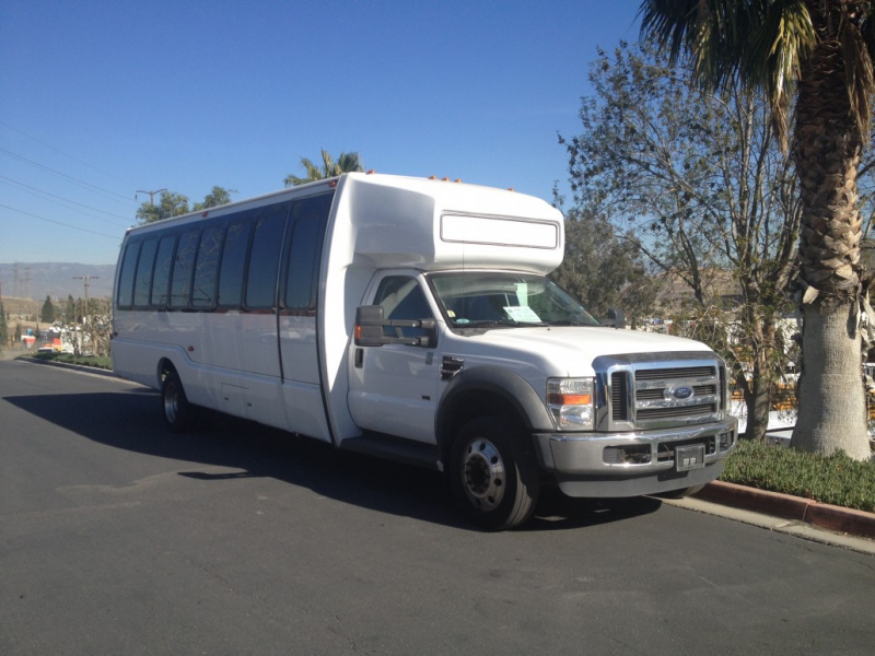 This Beautiful Pre-owned Shuttle Bus carries 29 passengers, has front ...
